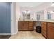 Bathroom featuring a double vanity with granite countertops and modern fixtures at 19555 Phillips Rd, Brooksville, FL 34604