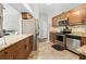 The updated kitchen features stainless steel appliances and granite countertops at 19555 Phillips Rd, Brooksville, FL 34604