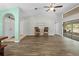 Bright and airy living room featuring new laminate flooring, vaulted ceilings and views of the backyard at 19555 Phillips Rd, Brooksville, FL 34604
