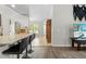Open living area featuring a bar counter, open shelving, and views into the living room at 19555 Phillips Rd, Brooksville, FL 34604