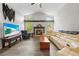 Inviting living room features vaulted ceilings, cozy fireplace, and ample natural light, perfect for relaxation at 19555 Phillips Rd, Brooksville, FL 34604