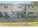 Charming backyard with a covered patio and lush green lawn, perfect for outdoor entertaining at 2192 Swedish Dr # 10, Clearwater, FL 33763