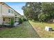 Spacious backyard with a covered patio and mature landscaping, great for outdoor activities at 2192 Swedish Dr # 10, Clearwater, FL 33763