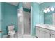 Bright bathroom featuring a glass-enclosed shower and a white vanity at 2192 Swedish Dr # 10, Clearwater, FL 33763