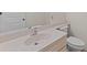 Bathroom featuring a white sink, countertop, and toilet at 2192 Swedish Dr # 10, Clearwater, FL 33763