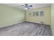 Open bedroom featuring plank floors, and windows at 2192 Swedish Dr # 10, Clearwater, FL 33763