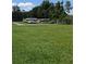 Outdoor boat storage area with multiple canoes and kayaks, perfect for water sports enthusiasts at 2192 Swedish Dr # 10, Clearwater, FL 33763