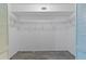 Walk-in closet featuring hardwood floors and built-in shelving at 2192 Swedish Dr # 10, Clearwater, FL 33763
