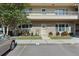 Two-story condo unit with brick facade and a cozy front garden, plus convenient parking at 2192 Swedish Dr # 10, Clearwater, FL 33763