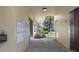 Condo hallway features mailboxes, elevator, and view to outdoors at 2192 Swedish Dr # 10, Clearwater, FL 33763