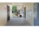 Condo hallway features mailboxes, elevator, and view to outdoors at 2192 Swedish Dr # 10, Clearwater, FL 33763