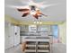 Spacious kitchen with an island, ceiling fan, and plenty of counter space at 2192 Swedish Dr # 10, Clearwater, FL 33763