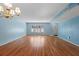 Cozy living room featuring hardwood floors and updated lighting at 2192 Swedish Dr # 10, Clearwater, FL 33763