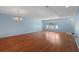 Bright living room with wood floors and natural light from the window at 2192 Swedish Dr # 10, Clearwater, FL 33763
