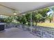 Enjoy the outdoors on this covered patio with a ceiling fan and views of the lush backyard at 2192 Swedish Dr # 10, Clearwater, FL 33763