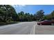 Street view showcasing mature trees and parked cars, adding to the community's charm and convenience at 2192 Swedish Dr # 10, Clearwater, FL 33763