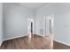 Spacious bedroom with wood-look floors and neutral walls at 2320 W Walnut St, Tampa, FL 33607