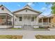 Charming home with inviting porch, detailed trim, and classic architecture at 2320 W Walnut St, Tampa, FL 33607