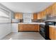 Well-lit kitchen featuring wood cabinets, modern appliances, and plenty of counter space at 2320 W Walnut St, Tampa, FL 33607