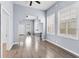 Spacious living room featuring wood-look floors, neutral walls, and lots of natural light at 2320 W Walnut St, Tampa, FL 33607