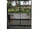 View from a balcony overlooking a lush green landscape with mature trees and well-maintained lawns at 2332 S Fairway Dr, Plant City, FL 33566