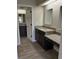 Bathroom features granite countertops, wood-look tile flooring and a spacious vanity area at 2332 S Fairway Dr, Plant City, FL 33566