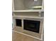Close-up of the fireplace, highlighting the stone surround, hearth and white mantel at 2332 S Fairway Dr, Plant City, FL 33566