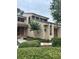 Charming two-story home featuring manicured landscaping and a welcoming front entrance with a red door at 2332 S Fairway Dr, Plant City, FL 33566