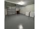 Spacious garage with washer and dryer hookups provides ample room for parking and storage at 2332 S Fairway Dr, Plant City, FL 33566