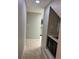 Hallway leading to kitchen, showcasing tiled floors and a vanity area at 2332 S Fairway Dr, Plant City, FL 33566