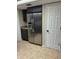 Modern kitchen with stainless steel refrigerator, and dark wood cabinetry at 2332 S Fairway Dr, Plant City, FL 33566