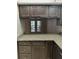 Stylish kitchen with dark wood cabinets and granite countertops overlooking the exterior at 2332 S Fairway Dr, Plant City, FL 33566