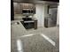 Well-equipped kitchen featuring stainless steel appliances, granite countertops, and dark wood cabinetry at 2332 S Fairway Dr, Plant City, FL 33566
