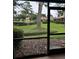 Relaxing screened lanai with lush landscaping views, providing a serene outdoor experience at 2332 S Fairway Dr, Plant City, FL 33566