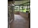 Enclosed lanai providing a relaxing outdoor space with views of the community landscape at 2332 S Fairway Dr, Plant City, FL 33566