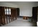 View of a room with window and exposed wall studs, awaiting renovation and personalization at 2470 Del Rio Way, Dunedin, FL 34698