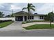 Charming single-story home with a cozy carport and beautiful mature palm tree at 2470 Del Rio Way, Dunedin, FL 34698