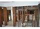 Exposed studs and plumbing in a spacious kitchen area ready for renovation and personalization at 2470 Del Rio Way, Dunedin, FL 34698