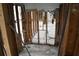 The kitchen space is framed with exposed studs ready for renovation and design at 2470 Del Rio Way, Dunedin, FL 34698