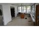 Living room with tile flooring and windows overlooking the backyard at 2470 Del Rio Way, Dunedin, FL 34698