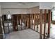 Large living room showing exposed walls and tile flooring at 2470 Del Rio Way, Dunedin, FL 34698