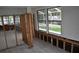 Open-concept living room with views of the pool area at 2470 Del Rio Way, Dunedin, FL 34698
