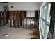 Large living room with tile flooring and window views at 2470 Del Rio Way, Dunedin, FL 34698