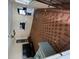 A living area featuring brick-red tile floors with a fan and plenty of natural light at 2524 Novus St, Sarasota, FL 34237