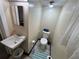 A smaller bathroom with a sink and toilet at 2701 W Cherry St, Tampa, FL 33607