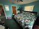 A bedroom with a queen-sized bed and blue walls at 2701 W Cherry St, Tampa, FL 33607