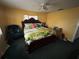Bedroom with a queen-sized bed, tropical bedding and plenty of natural light at 2701 W Cherry St, Tampa, FL 33607