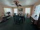 Bright dining room with carpet, ceiling fan and natural light at 2701 W Cherry St, Tampa, FL 33607