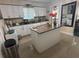 Bright kitchen with white cabinets, stainless steel appliances, granite countertops and a center island at 2701 W Cherry St, Tampa, FL 33607