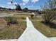 View from yard shows school in the background across the street at 2701 W Cherry St, Tampa, FL 33607